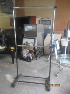 lot 17 image: BLACK STEEL CLOTHING RACK  TWO LEVELS OF STORAGE ON WHEELS