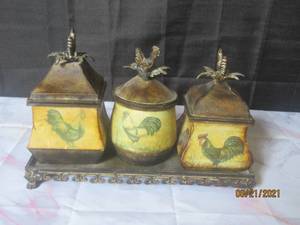lot 29 image: 3- PIECE ROOSTER LIDDED KITCHEN METAL  CANISTER SET  WITH PORTABLE METAL BASE