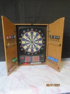 lot 11 image: HALEX ELECTRONIC DARTBOARD IN   HALEX WOOD CABINET WITH  20 PLUS DARTS