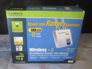 lot 122 image: LINKSYS 2.4 GHZ WIRELESS BROADBAND ROUTER WITH  SRX200  MODEL  WRT54GX2