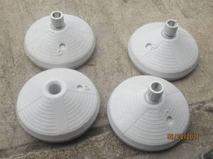 lot 194 image: 4 PATIO TABLE UMBRELLA HOLDERS