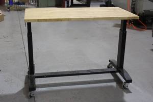 lot 9 image: ROLLING WOOD TOP TABLE WITH LOCKING CASTERS&nbsp