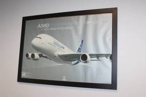 lot 129 image: AIR BUS A380 NON STOP INNOVATION BLACK WOOD FRAMED PICTURE POSTER , 39W X 27H