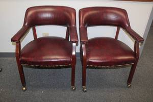 lot 277 image: TOTAL OF 2 OXBLOOD BURGUNDY LEATHER&nbsp ARM OFFICE CHAIRS WITH NAILHEAD TRIM &amp WOODEN LEGS ON BRASS CASTERS&nbsp