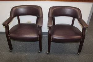 lot 278 image: TOTAL OF 2 BURGUNDY LEATHER ARM OFFICE CHAIRS WITH NAILHEAD TRIM &amp WOODEN LEGS ON BRASS CASTERS&nbsp