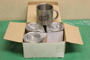 lot 49 image: NEW IN BOX EAT RIDE SLEEP STAINLESS STEEL MUGS SET OF 4