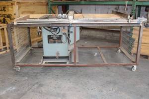 lot 12 image: DELTA UNISAW 10 TILTING ARBOR SAW 36-812 ON ROLLING CART WITH LOCKING CASTERS