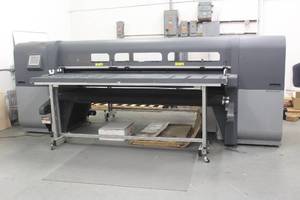 lot 74 image: HP SCITEX FB700 PRINTER WITH 4 ROLLER TABLES AND SOME INK&nbsp (WAS USED TO PRINT LABEL ON TABLE TOP IN LOT #73)