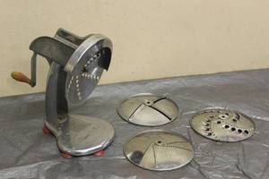 lot 17 image: VINTAGE SHRED- O-MAT WITH 4-ATTACHMENT SHREDDER SLICERS&nbsp  SEE PICS&nbsp
