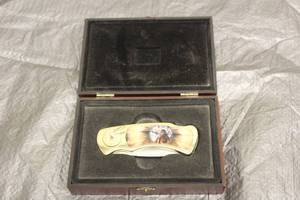 lot 142 image: SPIRIT OF THE WHITE WOLF NATIVE AMERICAN CHIEF WITH WOLF 142 COLLECTIBLE FOLDING POCKET KNIFE IN WOOD CASE&nbsp