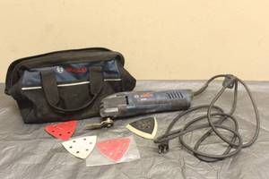 lot 32 image: BOSCH OSCILLATING MX25E MULTI-TOOL WITH LOT OF TRIANGLE SANDING SHEET&nbsp PAPERS WITH BOSCH TOOL BAG&nbsp