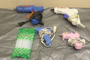 lot 100 image: TOTAL OF 4 ASSORTED BRAND HOT GLUE GUNS WITH PK OF 20 MINITURE GLUE STICKS&nbsp