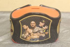lot 176 image: 2014 WWE THE ROCK , JOHN CENA, CM PUNK CERAMIC WRESTLING BELT MONEY PIGGY BANK , 7 X 8.5