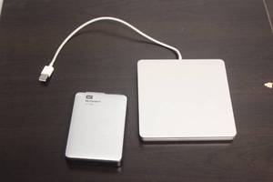 lot 63 image: MAC WD MY PASSPORT 2315B AND APPLE EXTERNAL DISC DRIVE
