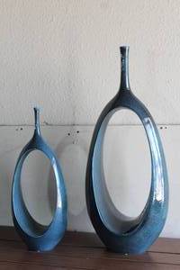 lot 75 image: 2 GLOBAL VIEWS CERAMIC OPEN OVAL RING VASES 22 AND 30 TALL