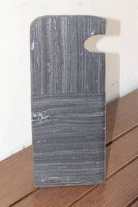 lot 81 image: FOUR HANDS TAB STONE SCUPTURE ROUGH BLACK MARBLE