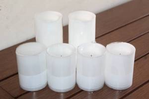 lot 96 image: 6 CRATE AND BARREL WHITE FLAMLESS CANDLES&nbsp