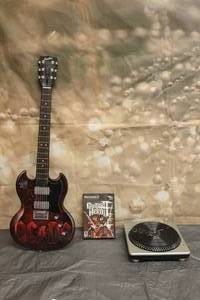 lot 112 image: PLAYSTATION 2 GUITAR HERO GAME DJ HERO PAPER JAMZ GUITAR WIRELESS TURNTABLE ACDC WOWWEE 2009&nbsp