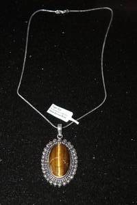 lot 214 image: TIGER EYE PENDANT NECKLACE WITH GERMAN SILVER CHAIN