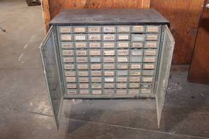 lot 98 image: 70 DRAWER METAL 2 DOOR STORAGE WITH CONTENTS SEE PICS