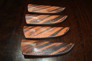 lot 128 image: 4. COWHIDE LEATHER SHEATHS