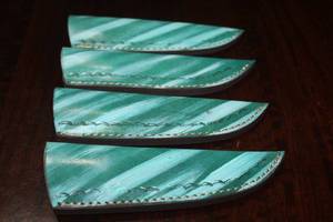 lot 129 image: 4. COWHIDE LEATHER SHEATHS