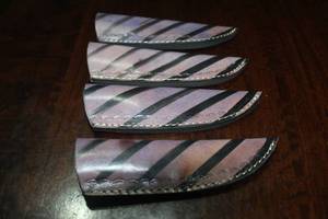 lot 130 image: 4. COWHIDE LEATHER SHEATHS