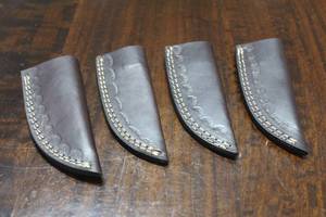 lot 142 image: 4. COWHIDE LEATHER SHEATHS