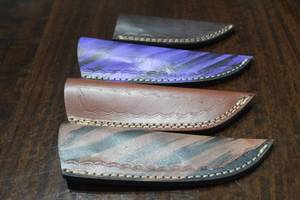lot 143 image: 4. COWHIDE LEATHER SHEATHS