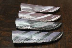 lot 147 image: 4. COWHIDE LEATHER SHEATHS