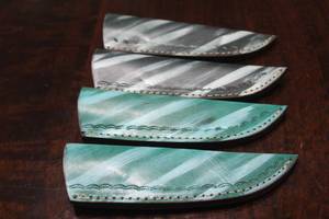 lot 146 image: 4. COWHIDE LEATHER SHEATHS