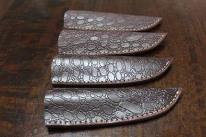 lot 151 image: 4. COWHIDE LEATHER SHEATHS