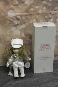 lot 17 image: 1998 PRECIOUS MOMENTS 13 DOLL COLLECTION DRUM MAJOR STRIKE UP THE BAND No. 1379 WITH STORAGE BOX&nbsp