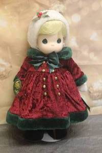 lot 43 image: 1996 PRECIOUS MOMENTS 16 DOLL COLLECTION No. 1220&nbsp STAR LIMITED EDITION OF 5,000 WITH STAND&nbsp