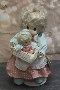 lot 45 image: 1993 PRECIOUS MOMENTS 16 DOLL COLLECTION MILLY AND HER NEW BABY DOLL WITH STAND No 1048&nbsp