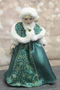 lot 53 image: VINTAGE AVON 2001 HOLIDAY RADIANCE 16 SPECIAL MEMORIES CHRISTMAS PORCELAIN DOLL LORRAINE WITH STAND No 32445