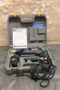 lot 74 image: RYOBI 12 HAMMER DRILL VARIBLE INSULATED D551H WITH CASE