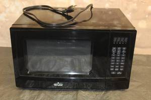 lot 110 image: RIVAL MICROWAVE OVEN KOR-9G3A