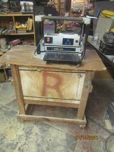 lot 72 image: DELTA SHOPMASTER MODEL TP305 PORTABLE PLANER ATTACHED TO WOOD ROLLING CRATE
