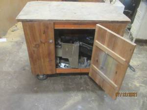 lot 84 image: ROLLING WOOD 2-DOOR CABINET WITH CONTENTS