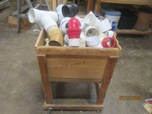 lot 93 image: GENEROUS AMOUNT OF PLASTIC PVC PIPES ,WOOD PUSH CART INCLUDED