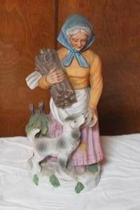 lot 51 image: RURAL OLD WOMAN COUNTRY FARMER WITH DOG HOLDING WOOD BISQUE FIGURINE 11 TALL