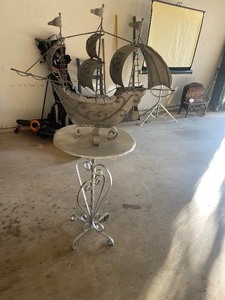 lot 188 image: METAL SIDE TABLE WITH METAL SHIP ATTACHED ROOM DECOR