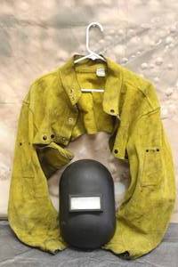 lot 35 image: WELDING CAPE SLEEVE JACKET AND WELDING HELMET