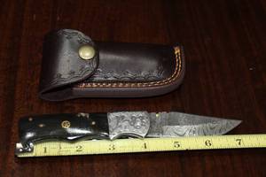 lot 96 image: DAMACAS STEEL FOLDING KNIFE WITH CUSTOM HAND CARVED HANDLE