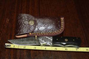 lot 98 image: DAMACAS STEEL FOLDING KNIFE WITH CUSTOM HAND CARVED HANDLE