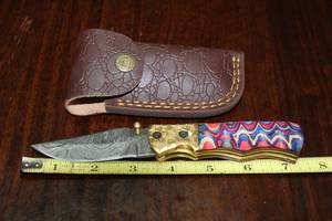 lot 99 image: DAMACAS STEEL FOLDING KNIFE WITH CUSTOM HAND CARVED HANDLE