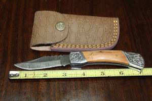 lot 100 image: DAMACAS STEEL FOLDING KNIFE WITH CUSTOM HAND CARVED HANDLE