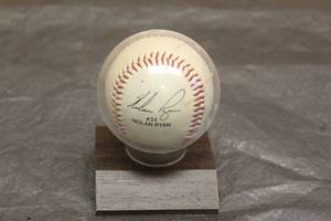 lot 81 image: NOLAN RYAN #34 AUTOGRAPHED BASEBALL IN WOOD DISPLAY