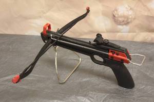 lot 32 image: SELF COCKING MINI CROSSBOW